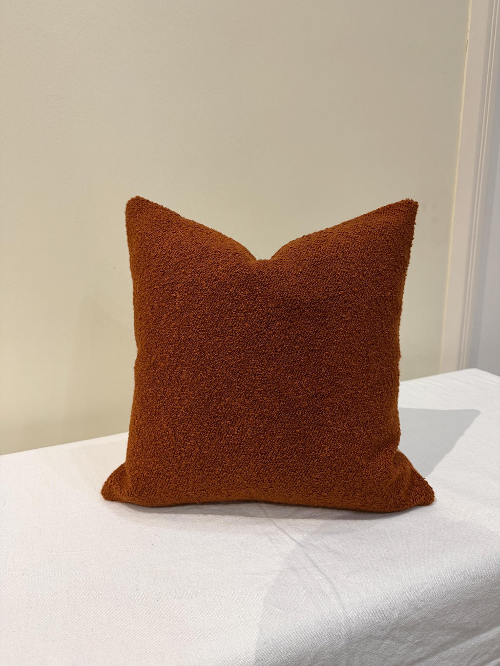 Burnt orange bouclé textured pillow cover