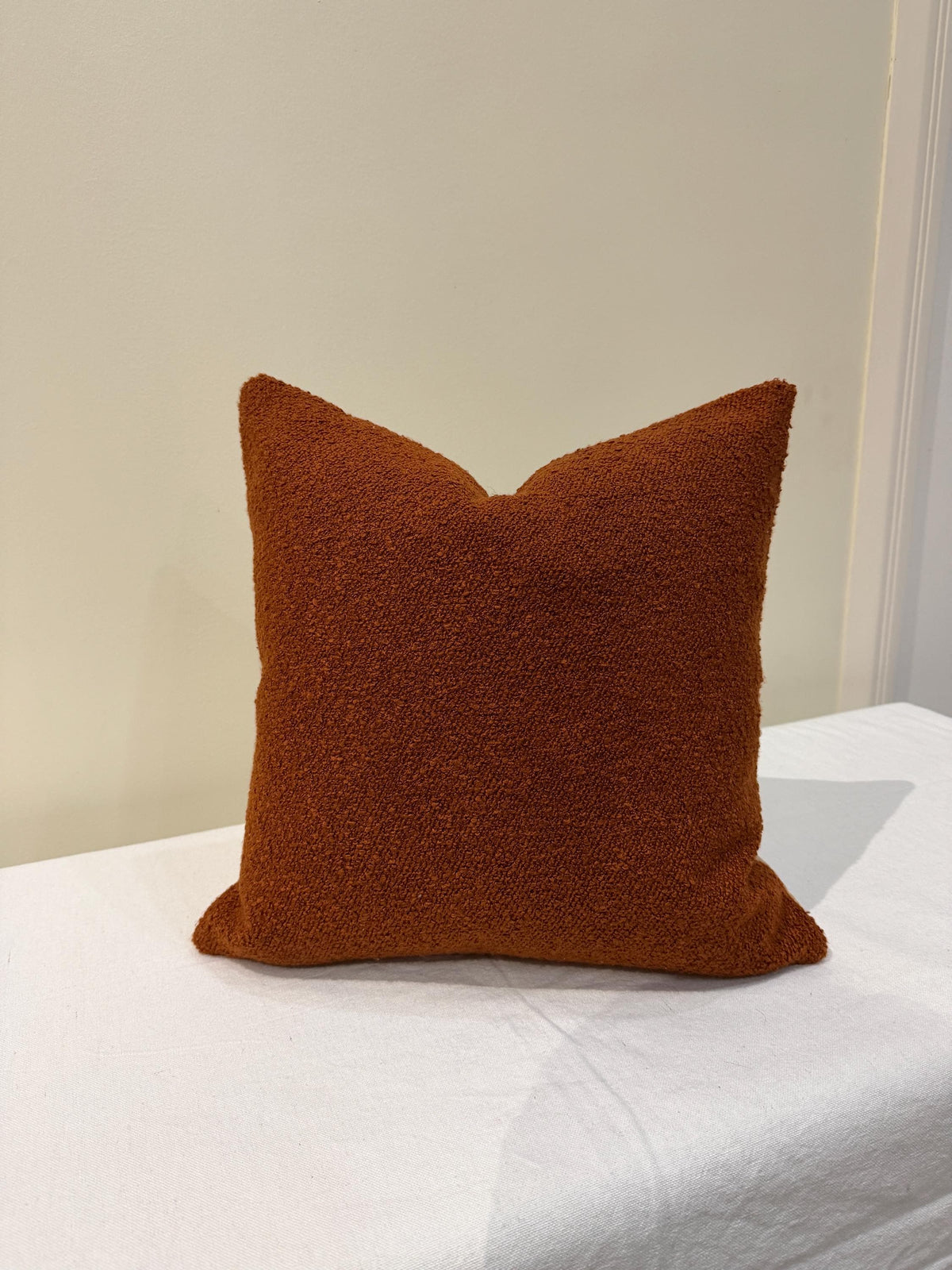 Burnt orange bouclé textured pillow cover