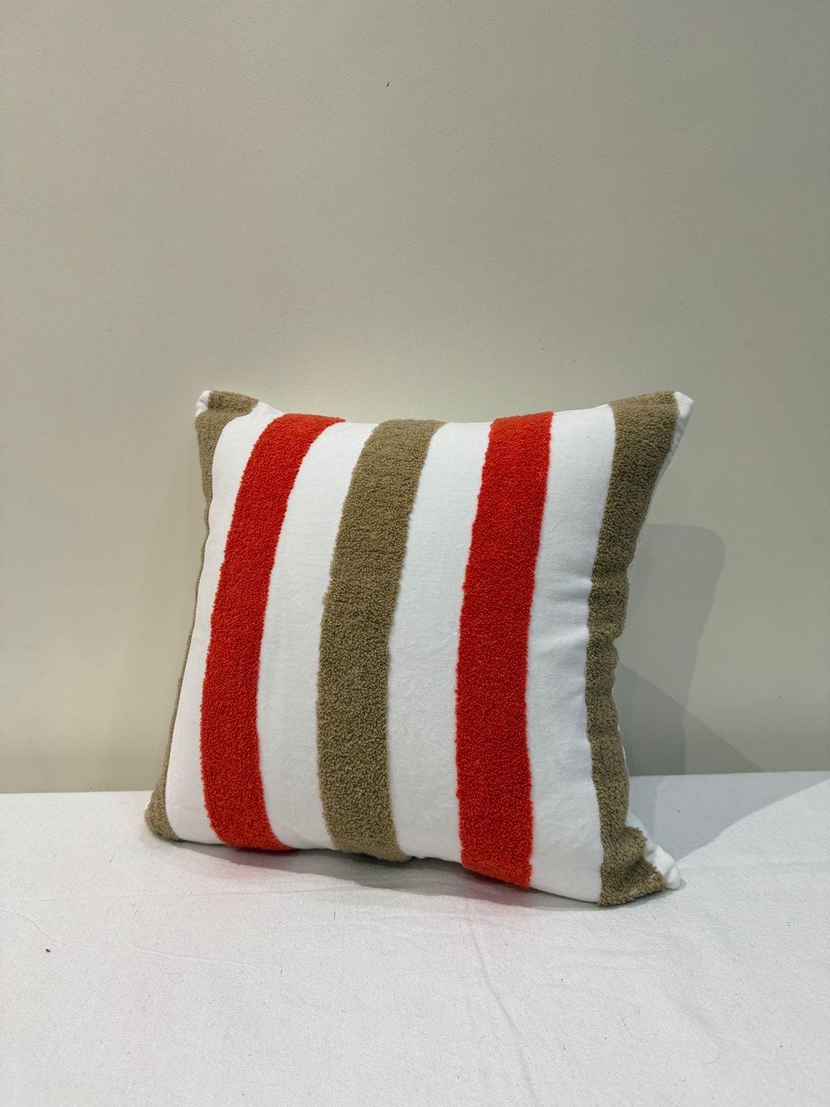 Red-orange and tan tufted chenille pillow cover